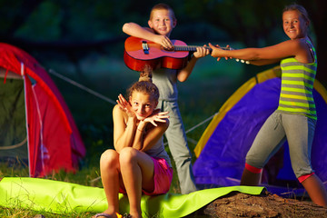 teenage kids having fun in summer camp