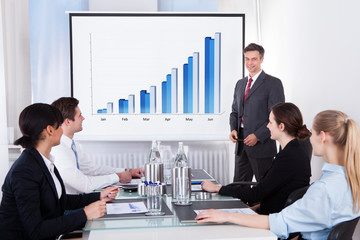Businessman Explaining Graph