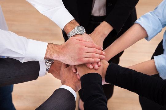 Businesspeople Stacking Their Hands