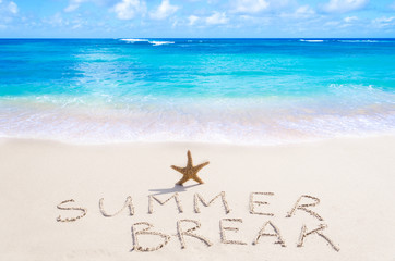 Sign"Summer break" with starfish on the beach