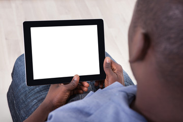 African Person Sitting With Digital Tablet