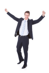 Happy Young Excited Businessman Raising Hands