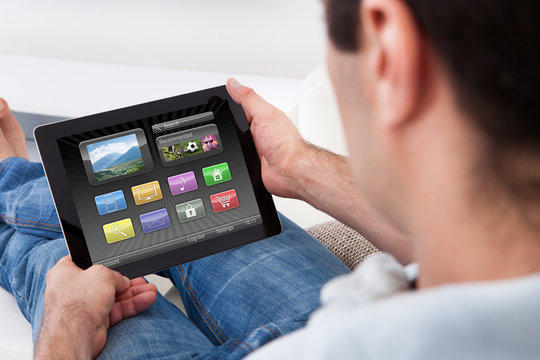 Man Holding Tablet Pc With Icons