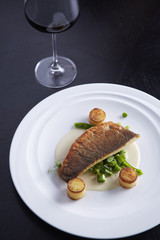 Grilled sea-bass in white sauce