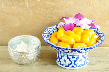 Kanom med Kanoon on wood background