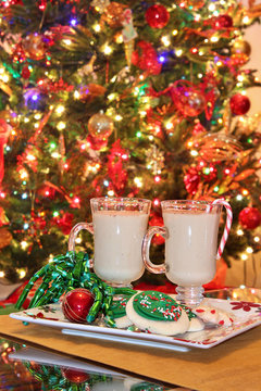 Mugs Of Egg Nog With Christmas Tree Background