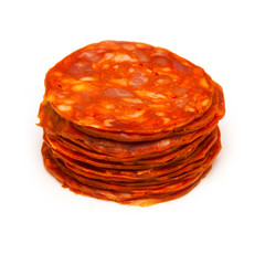 Sliced chorizo sausage isolated on a white studio background.