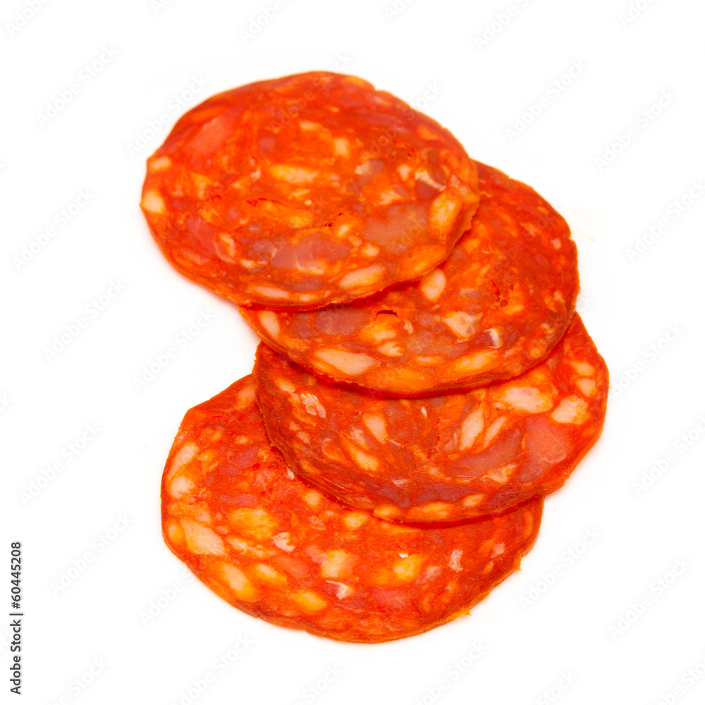 Canvas Prints Sliced chorizo sausage isolated on a white studio background.