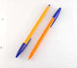 Two pen on the checked paper
