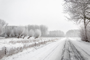 Snowy country road in in wintertime