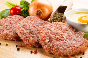 Raw minced pork chops meat on white background