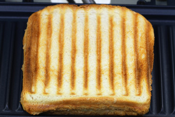 Toasted sandwich in toaster, close up