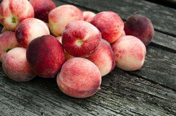 fresh peaches on wooden table