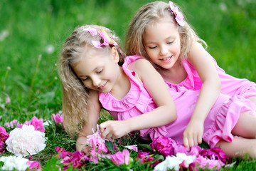 portrait of two twins with peonies