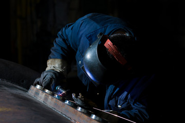 Welder working at the factory