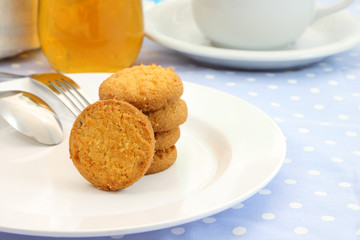 Round cookie stack plate on table meal.