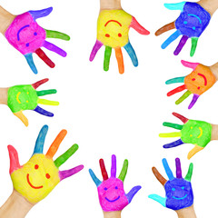 human hands painted in colorful paint with smiles.