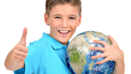 Smiling boy in casual  holding planet earth with thumbs up