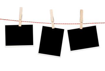 Blank photos hanging on clothesline