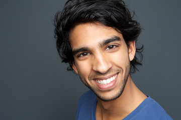 Close up portrait of a cheerful young man smiling