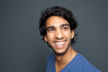 Fototapeta na wymiar Close up portrait of a happy young man smiling
