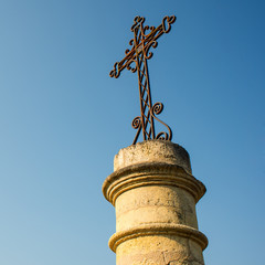 Fototapeta premium iron cross on stone base