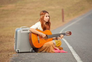Hippie woman playing music