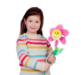 Beautiful little girl with a pinwheel