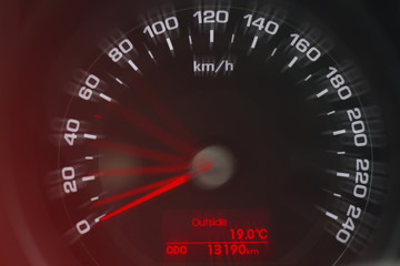 Speedometer close up view. White and red
