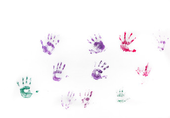 Children's hand prints on white wall