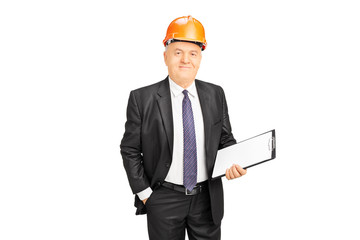Mature construction worker holding clipboard