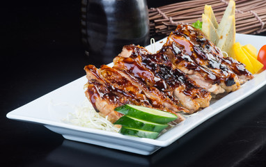 japanese cuisine. grilled chicken on the background