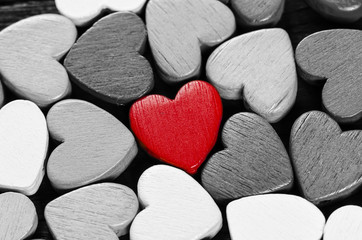 Red heart and many black and white hearts.