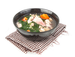 Bowl of squid soup isolated on white