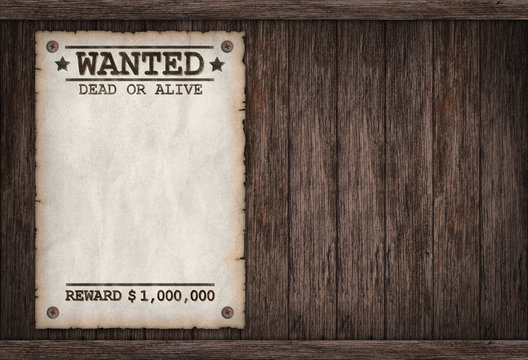 Torn Wild West wanted poster on old wooden wall 