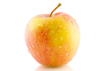 Apple in drops of water isolated on white