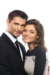 Beautiful young couple in suit and dress 