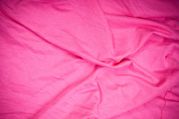 pink fabric with folds background