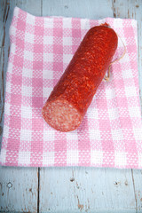 half sausage on a plaid towel