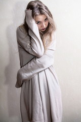 Beauty shy girl in wool cardigan
