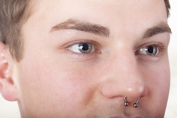 Form-fitting portrait of a pierced man