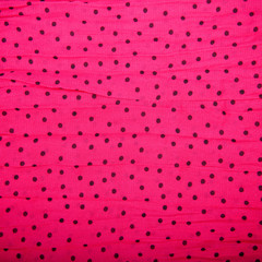 red textile background with black circles