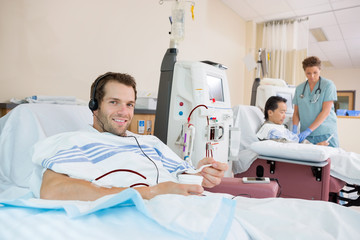 Patient Holding Glass Of Crushed Ice During Renal Dialysis