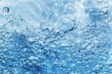 Clean water with bubbles appearing when pouring water