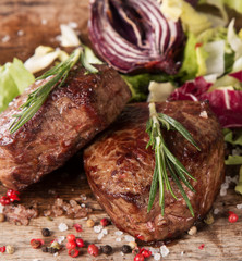 Grilled steaks on wood 