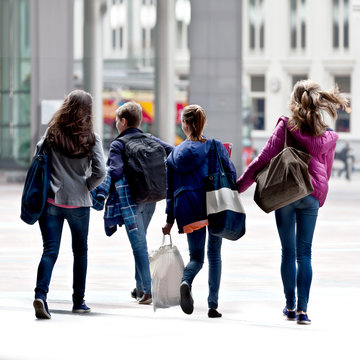 A group of teenagers on the street.