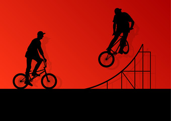 Obraz na płótnie Canvas Extreme cyclists bicycle riders active children sport silhouette