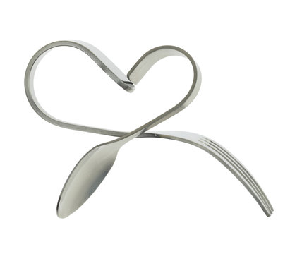 Fork and spoon bent in shape of heart isolated