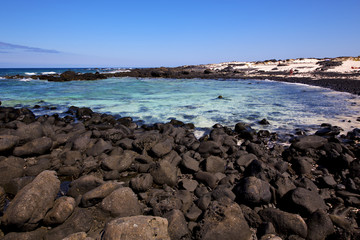 sky light  beach water  in lanzarote    landscape  stone  cloud