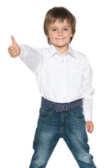 Fashion little boy holds his thumb up